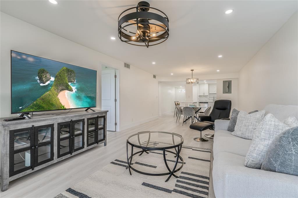 411 South Hollybrook Drive, Unit 109 Pembroke Pines, FL 33025 - Photo 3 of 61 a living room with furniture and a flat screen tv