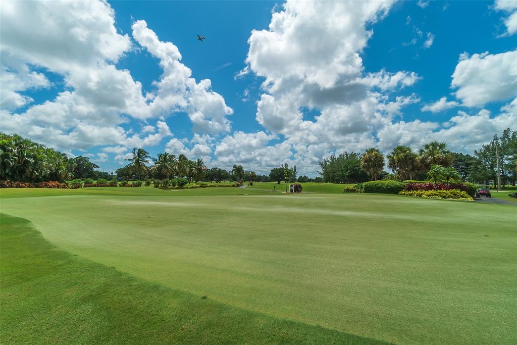411 South Hollybrook Drive, Unit 109 Pembroke Pines, FL 33025 - Photo 47 of 61 a view of a golf course with a lake