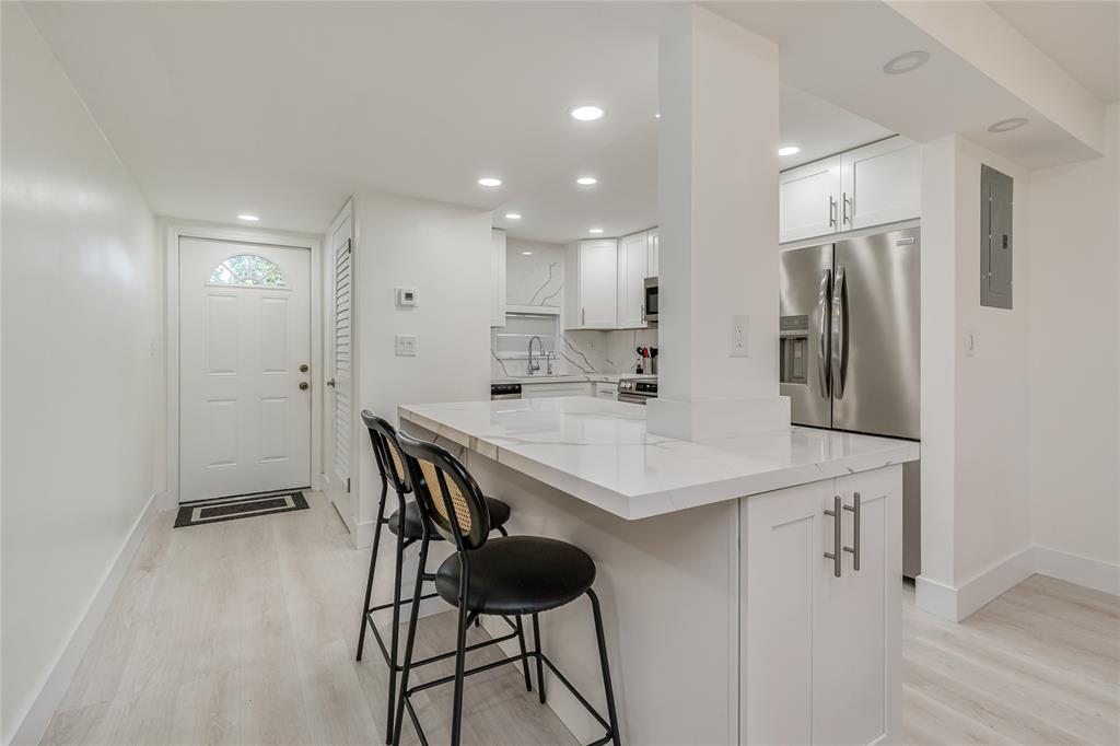 411 South Hollybrook Drive, Unit 109 Pembroke Pines, FL 33025 - Photo 10 of 61 a kitchen with stainless steel appliances a sink and a refrigerator
