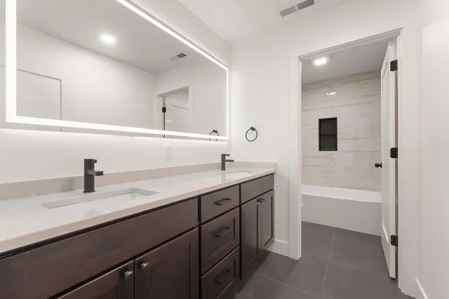 a bathroom with a bathtub and a toilet