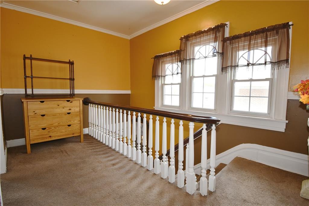 108 Locust Street Pittsburgh, PA 15210 - Photo 11 of 36 a view of a bedroom with furniture and windows