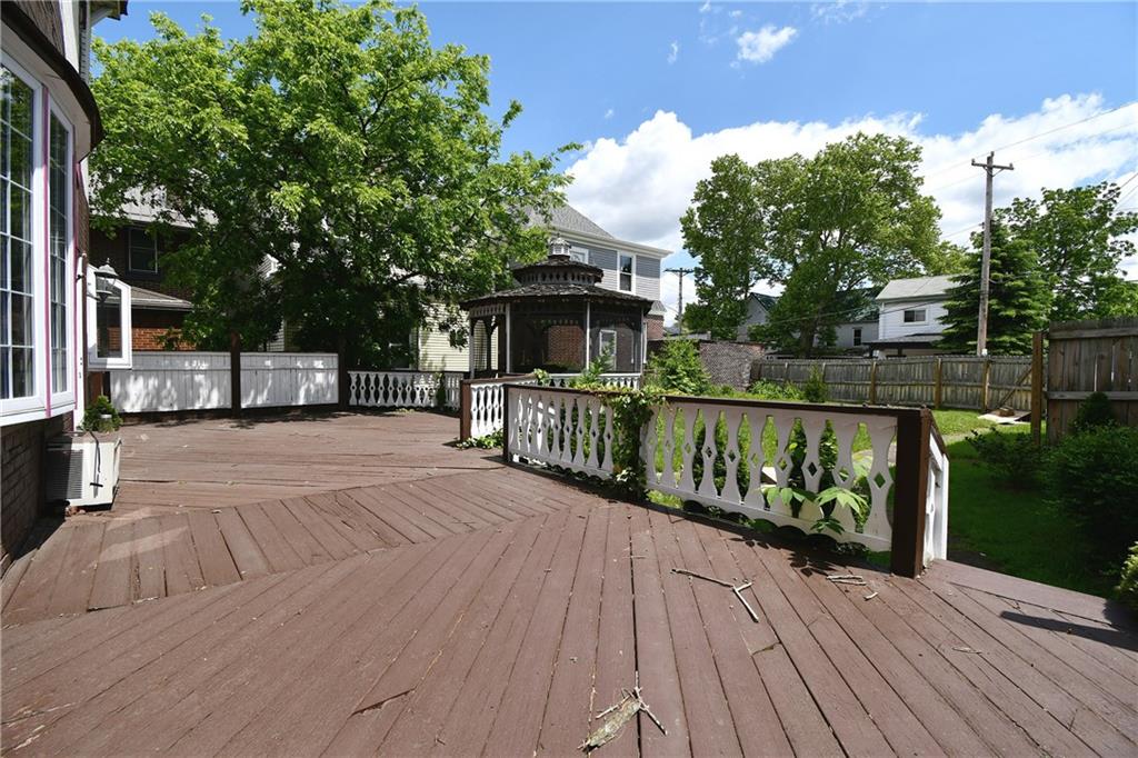 108 Locust Street Pittsburgh, PA 15210 - Photo 19 of 36 a view of house with deck outdoor seating and trees