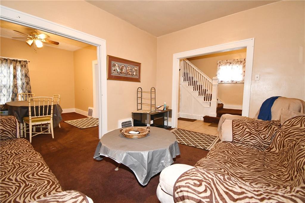 108 Locust Street Pittsburgh, PA 15210 - Photo 27 of 36 a living room with furniture and a table