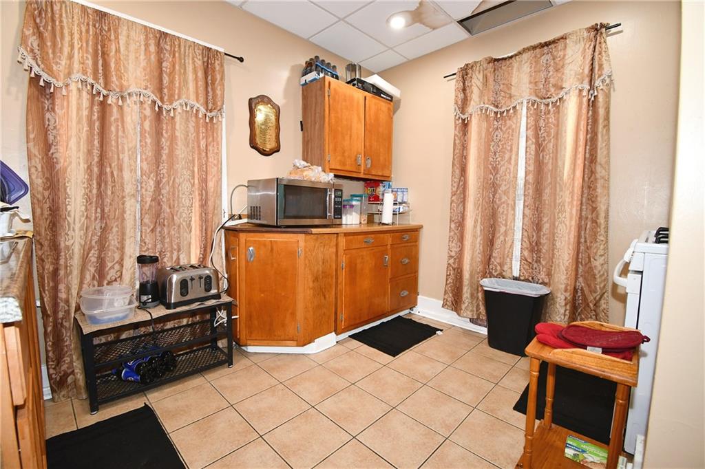 108 Locust Street Pittsburgh, PA 15210 - Photo 30 of 36 a kitchen with stainless steel appliances a stove and a refrigerator