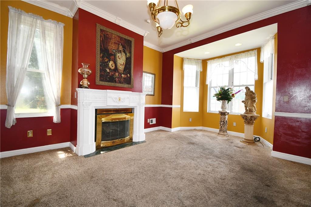 108 Locust Street Pittsburgh, PA 15210 - Photo 3 of 36 a living room with furniture and a fireplace