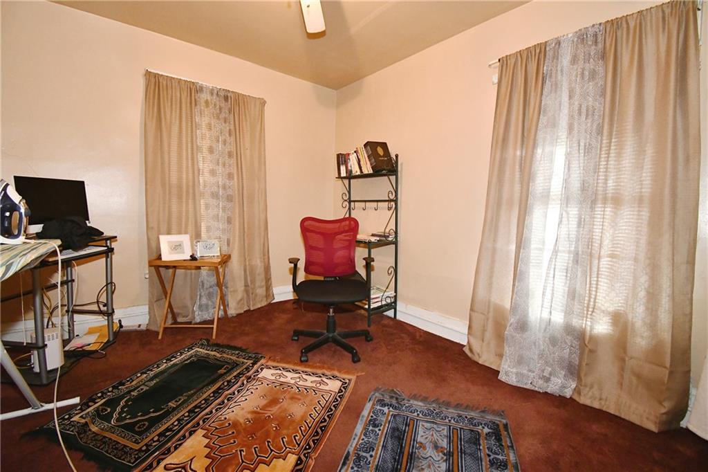 108 Locust Street Pittsburgh, PA 15210 - Photo 34 of 36 a room with gym equipment and wooden floor