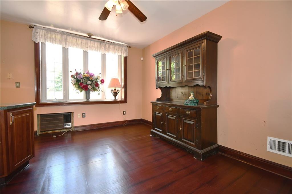 108 Locust Street Pittsburgh, PA 15210 - Photo 5 of 36 an empty room with wooden floor and furniture