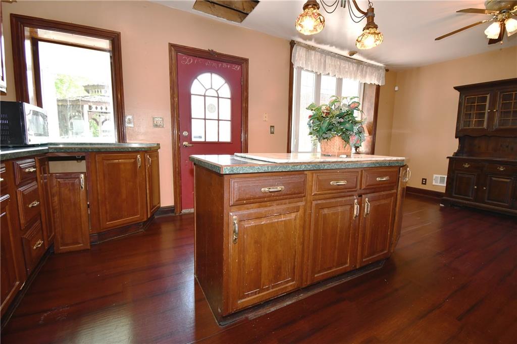 108 Locust Street Pittsburgh, PA 15210 - Photo 8 of 36 a view of cabinets with wooden floor and furniture