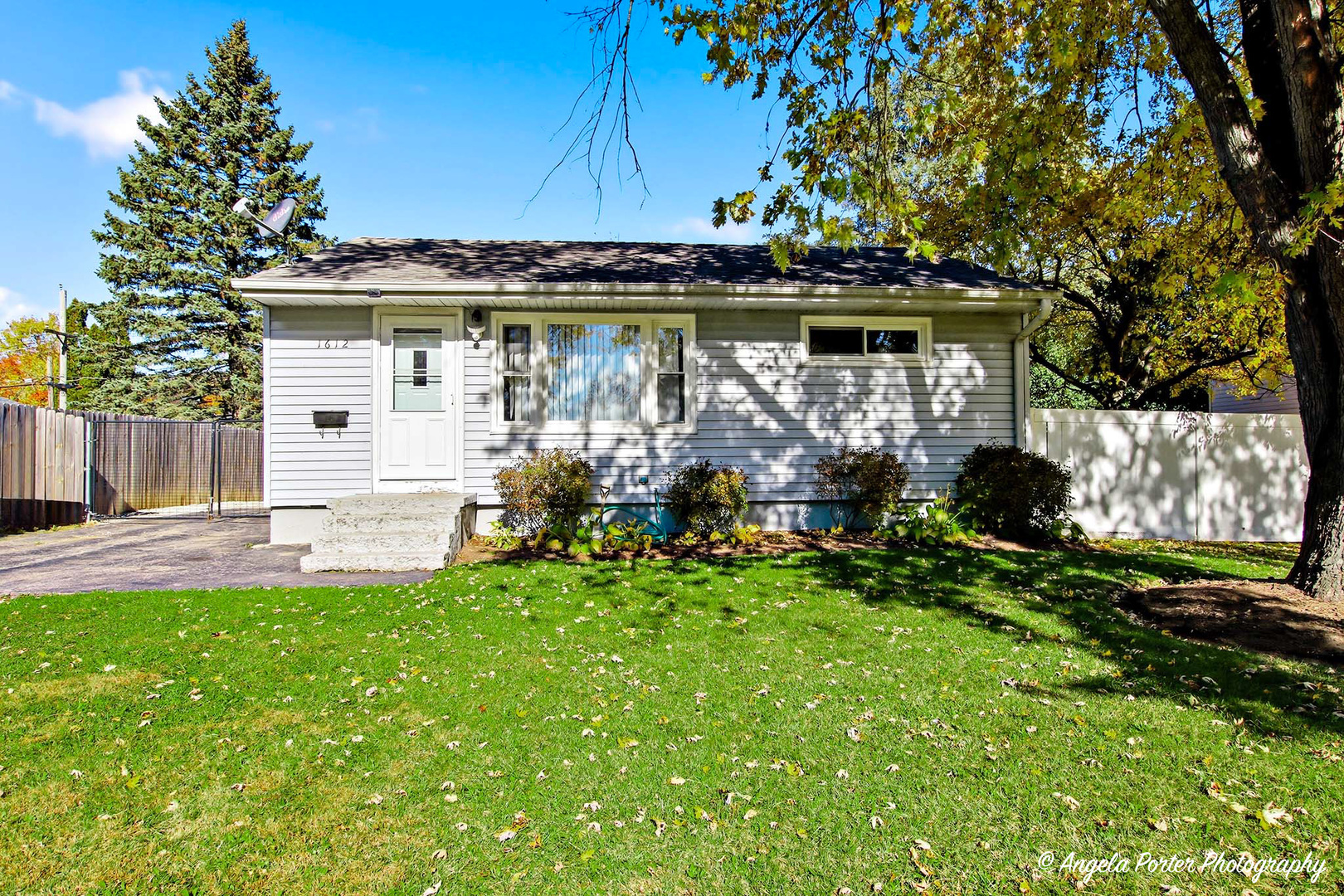 1612 Whitney Street Waukegan, IL 60087 - Photo 1 of 20 a view of a house with backyard and sitting area