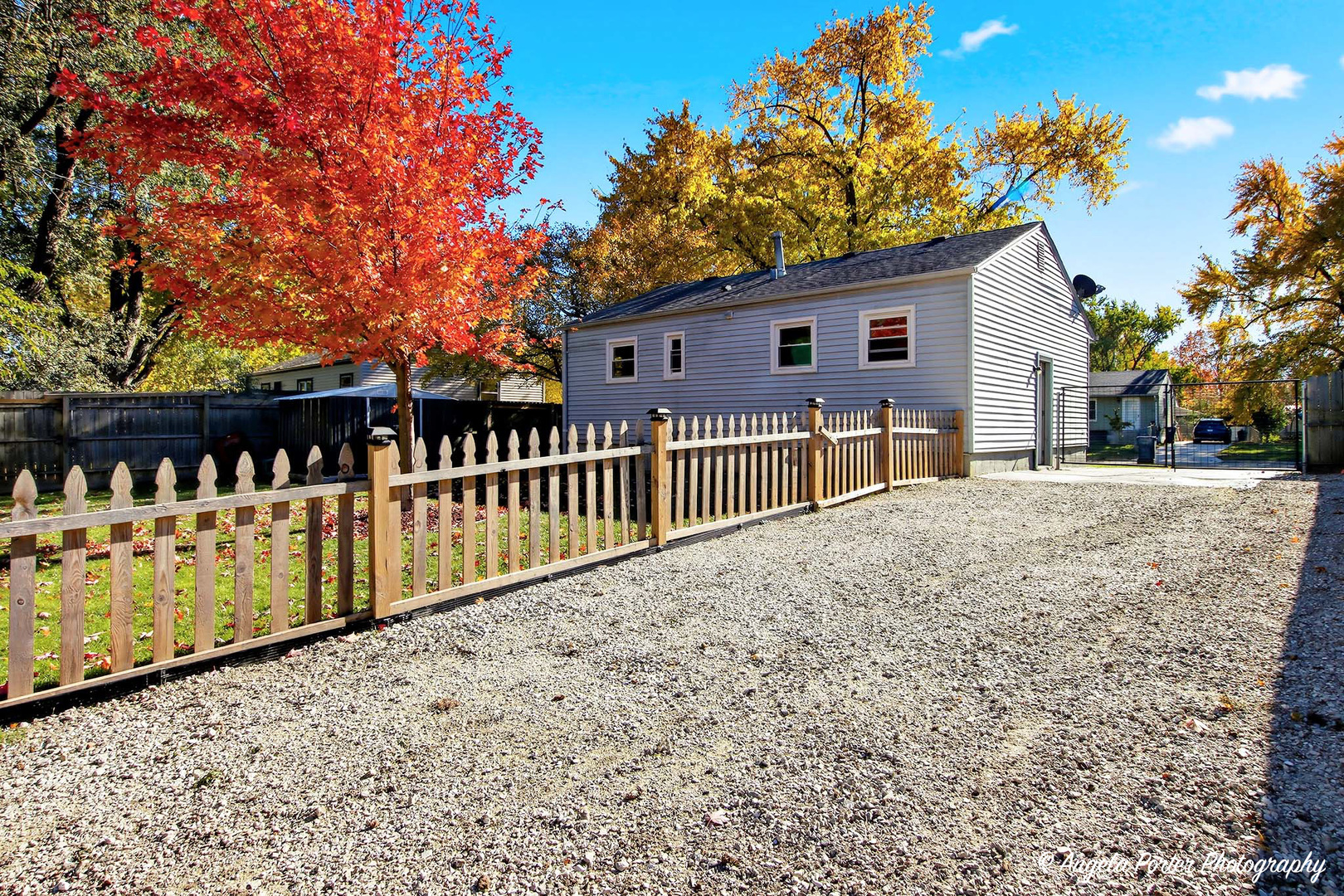 1612 Whitney Street Waukegan, IL 60087 - Photo 2 of 20 a view of a house with a wooden fence