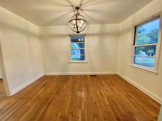 a view of a hallway with a chandelier