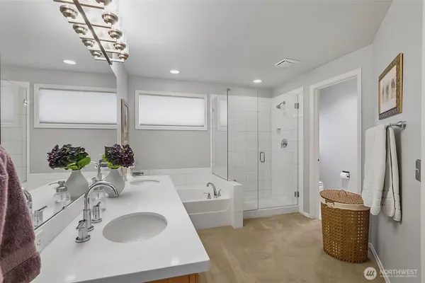 a bathroom with a granite countertop sink a shower and a mirror