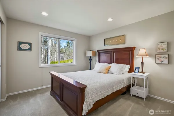 a bedroom with a bed and window