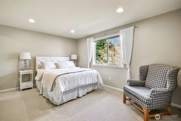 a bedroom with a bed and a couch