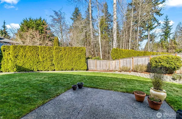 a view of a back yard with a patio