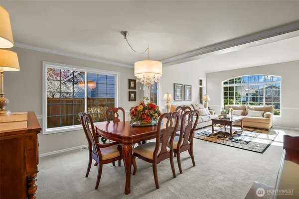 a view of a dining room with furniture window and outside view