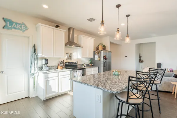 a kitchen with sink and a window