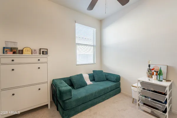 a living room with furniture and a window