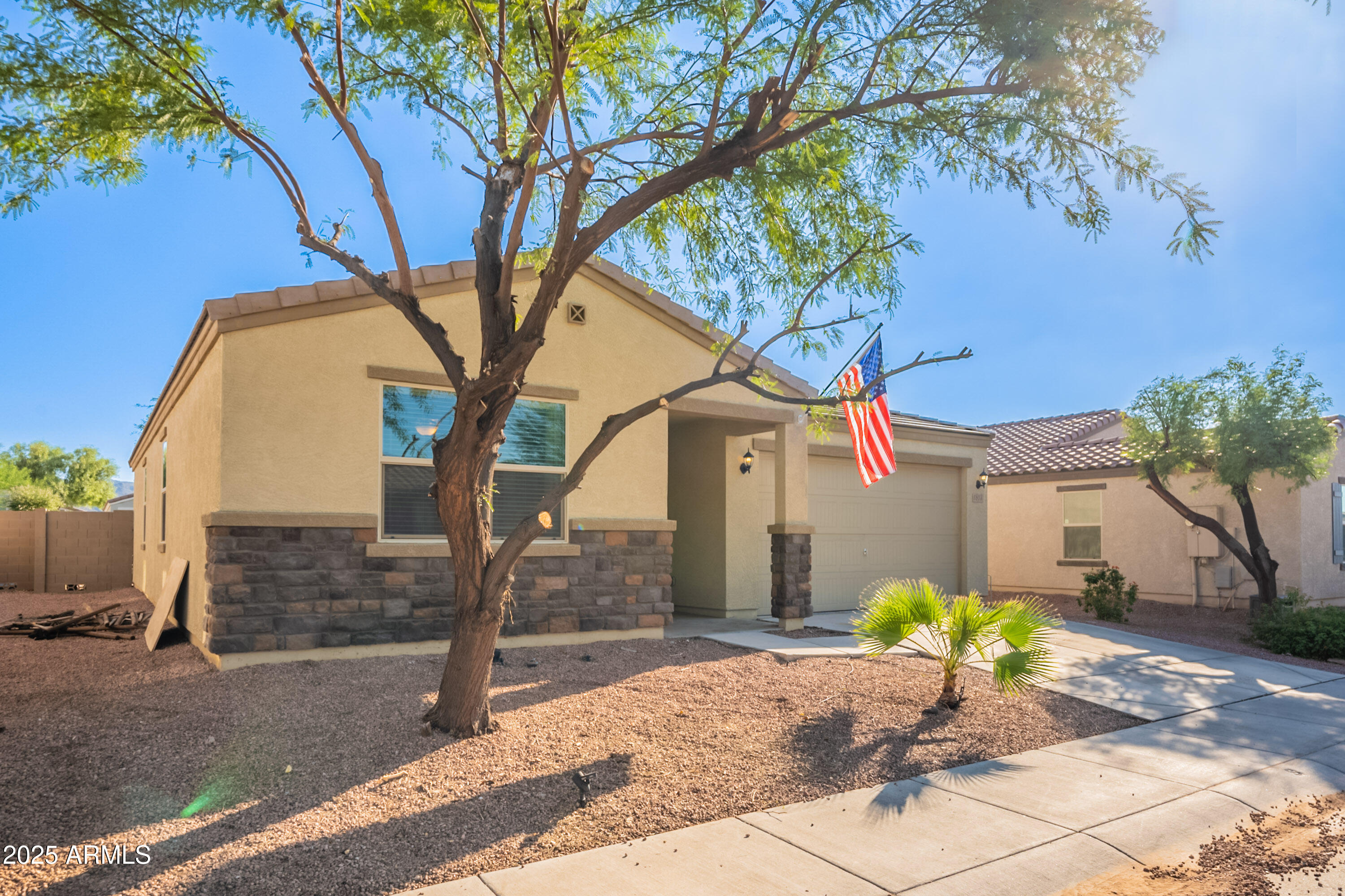 1813 Grenadine Road Phoenix, AZ 85040 - Photo 3 of 33 a front view of a house with garden
