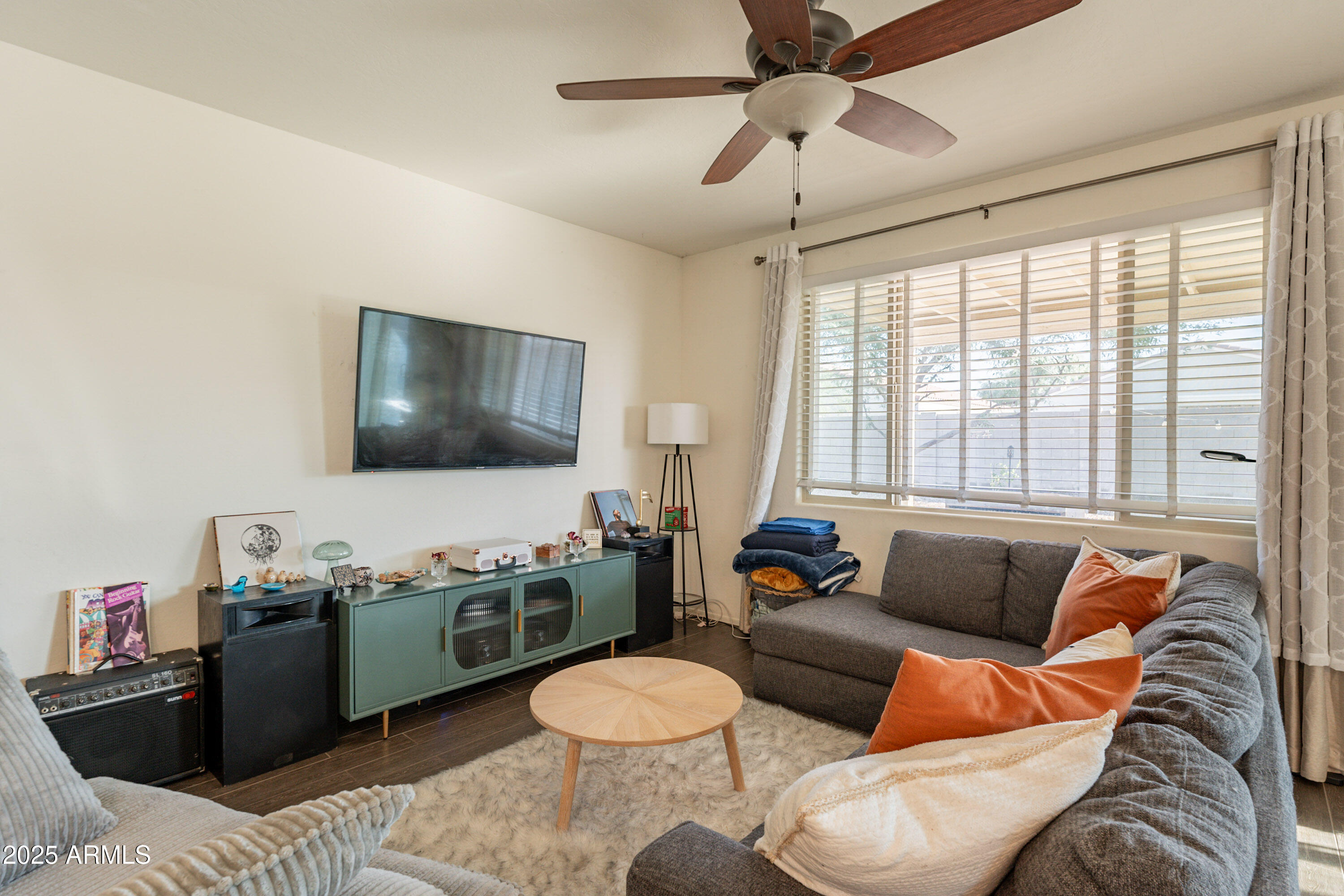 1813 Grenadine Road Phoenix, AZ 85040 - Photo 4 of 33 a living room with furniture and a flat screen tv