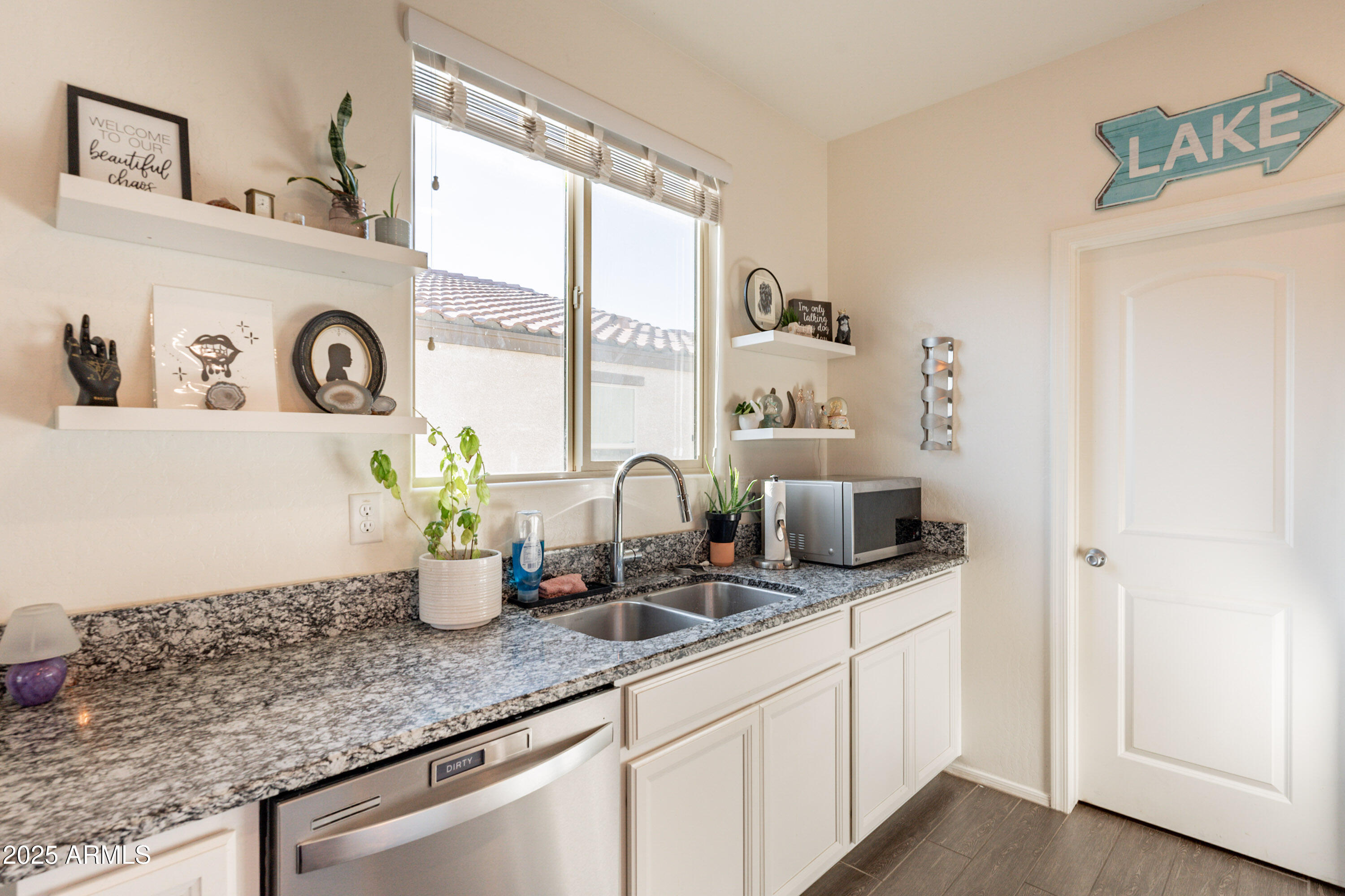 1813 Grenadine Road Phoenix, AZ 85040 - Photo 9 of 33 a kitchen with sink and a window