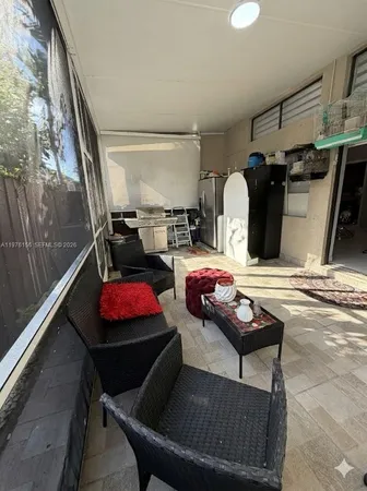 a living room with furniture and flat screen tv