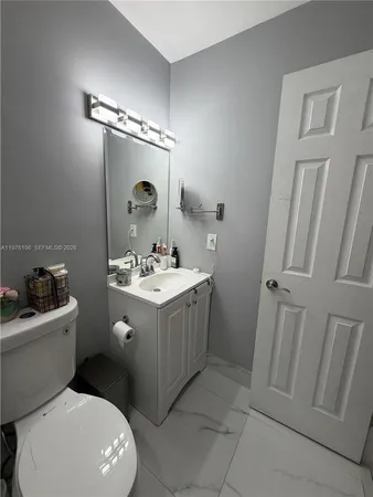 a bedroom with bed and window