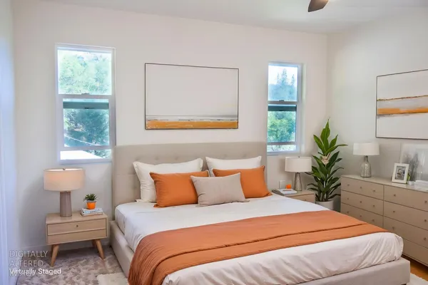 a bedroom with a bed and a window