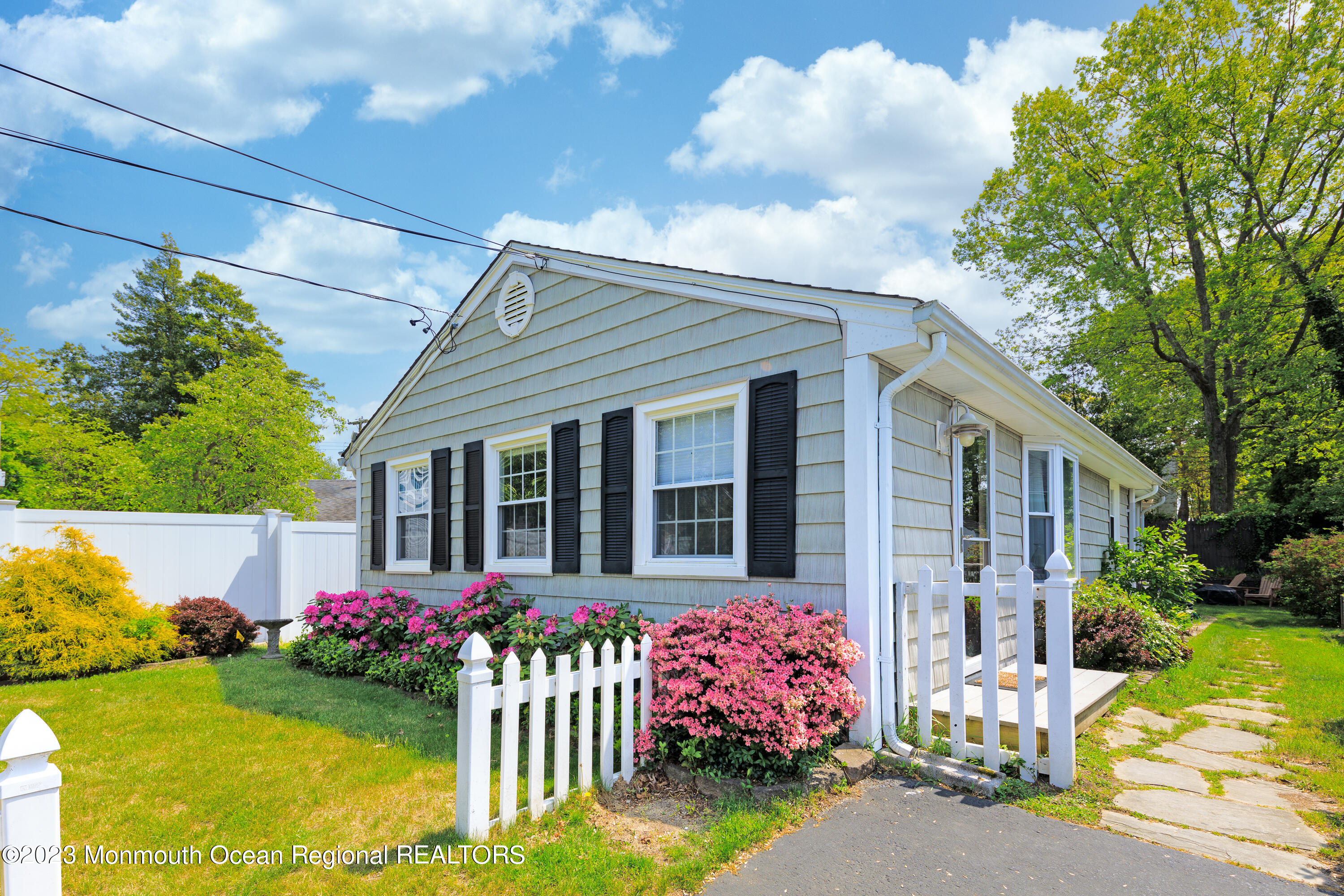 a front view of a house with yard