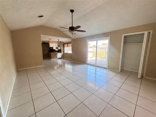a view of a kitchen with a sink and a window