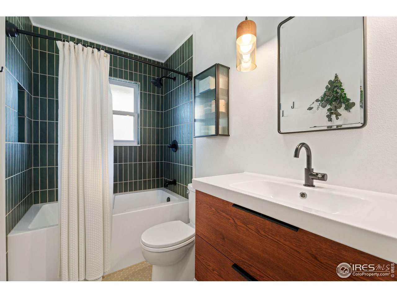 2600 Avocet Road Fort Collins, CO 80526 - Photo 11 of 26 Remodeled bathroom with custom tile work, deep soaking tub, custom vanity and custom lighting