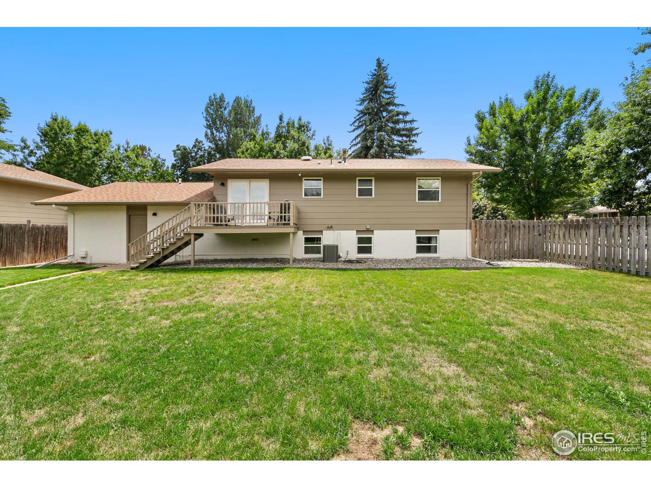2600 Avocet Road Fort Collins, CO 80526 - Photo 23 of 26 Fully fenced in yard with full sprinkler system and a raised garden bed. New, custom exterior landscaping and exterior paint.