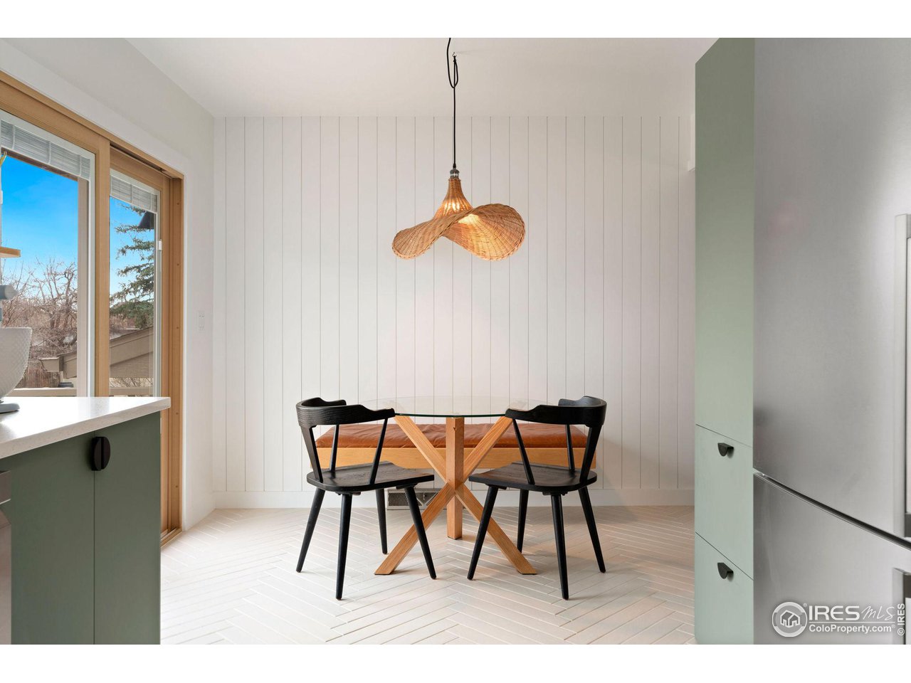 2600 Avocet Road Fort Collins, CO 80526 - Photo 5 of 26 Eat-in kitchen with custom bench, shiplap wall and custom lighting.
