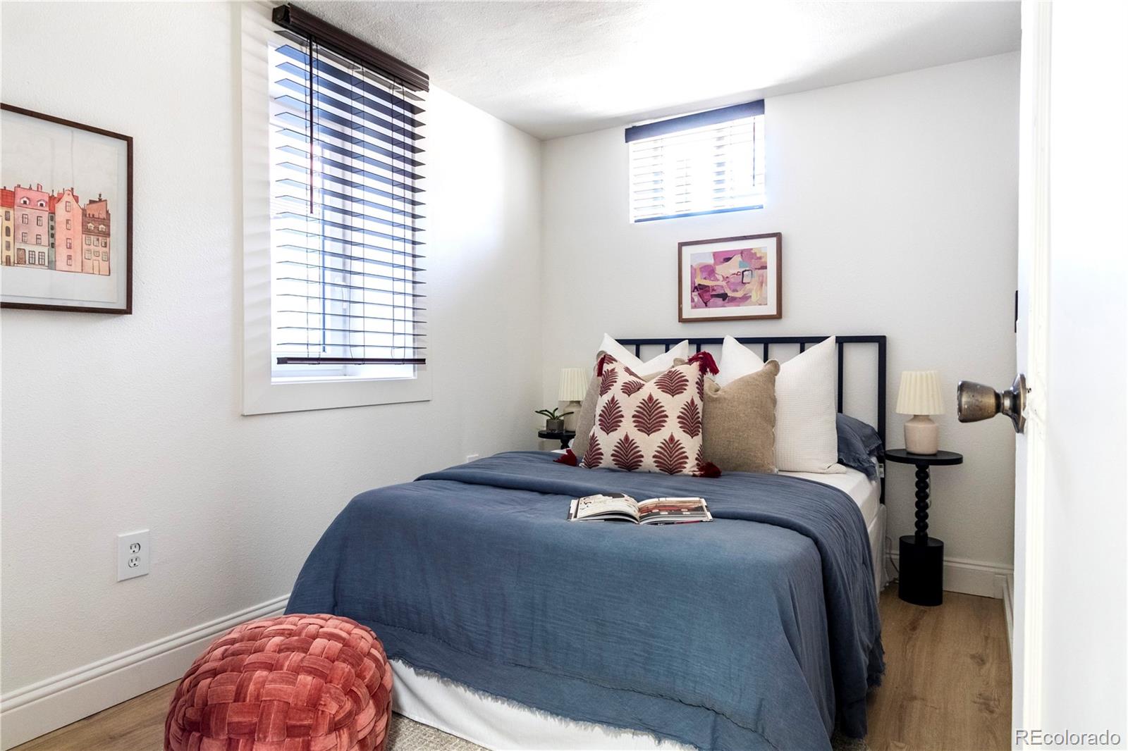 3200 Vine Street Denver, CO 80205 - Photo 24 of 31 a bed sitting in a bedroom next to a window