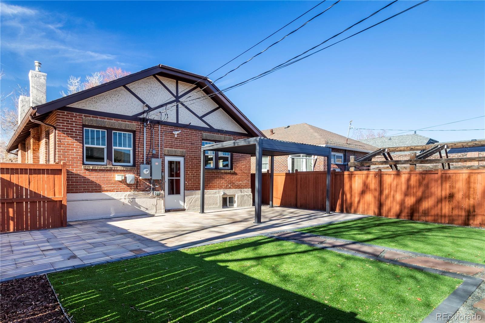 3200 Vine Street Denver, CO 80205 - Photo 26 of 31 a view of a house with a yard and furniture