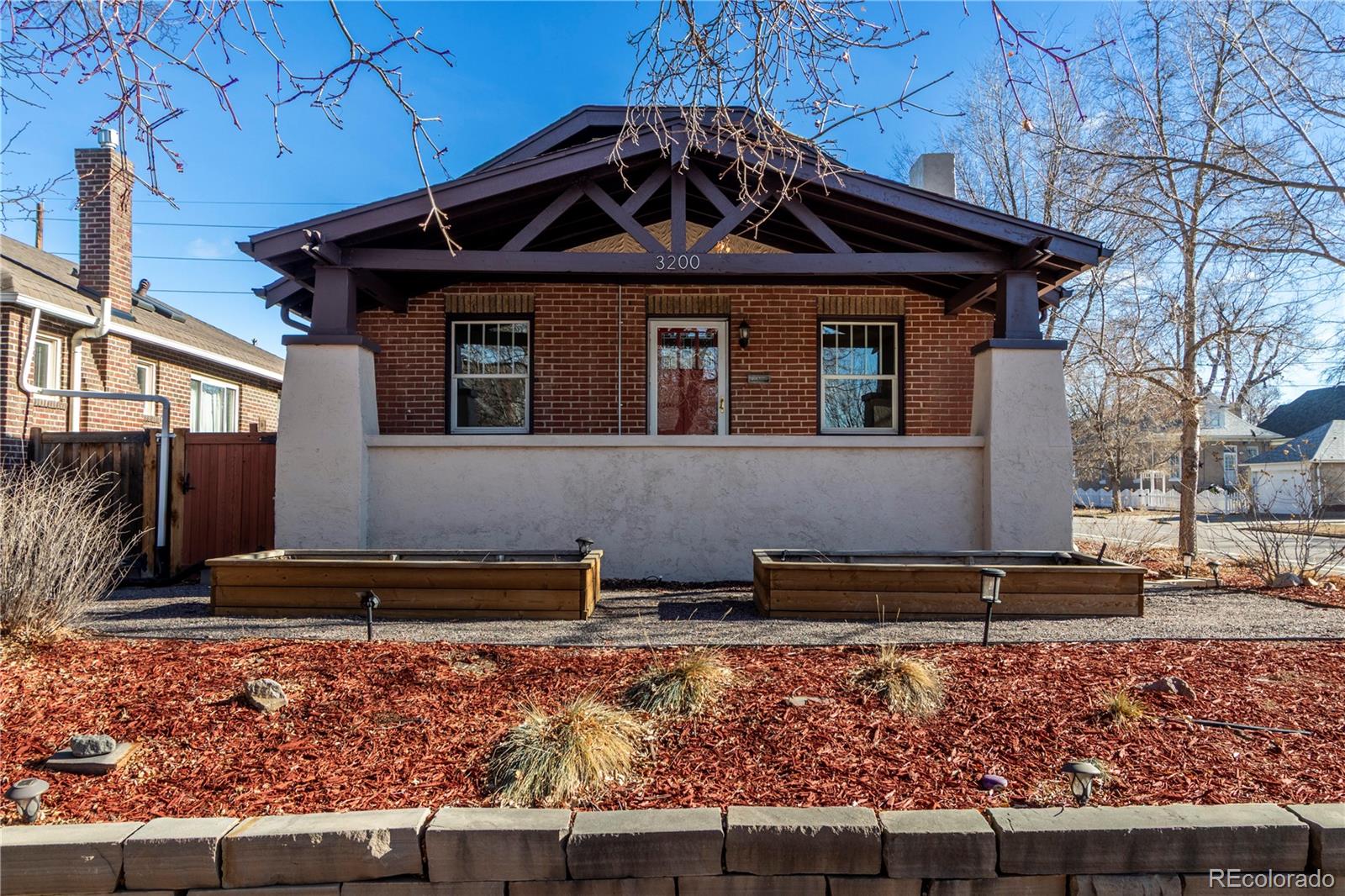 3200 Vine Street Denver, CO 80205 - Photo 29 of 31 a front view of a house with garden