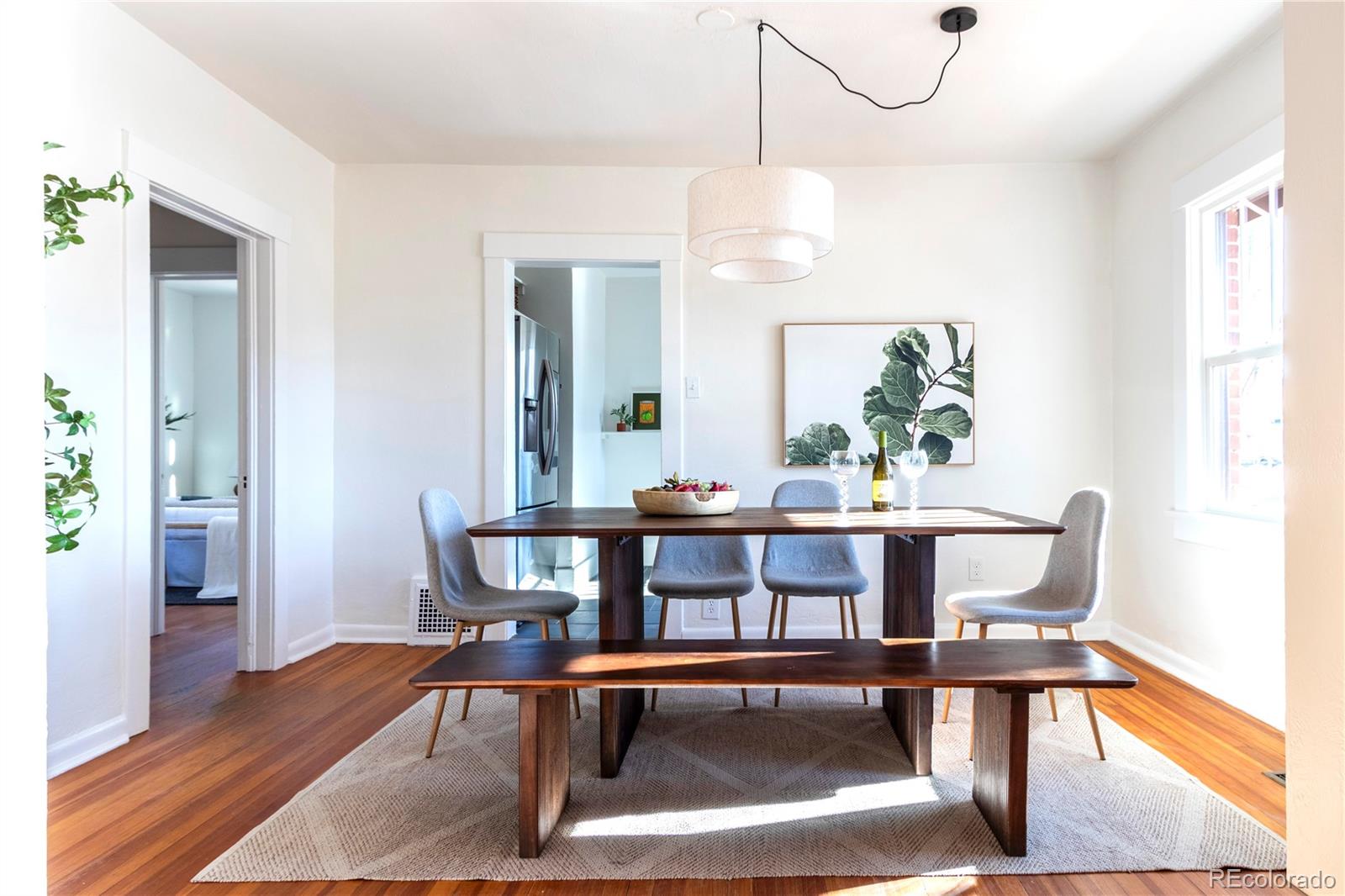 3200 Vine Street Denver, CO 80205 - Photo 4 of 31 a view of a dining room with furniture window and wooden floor