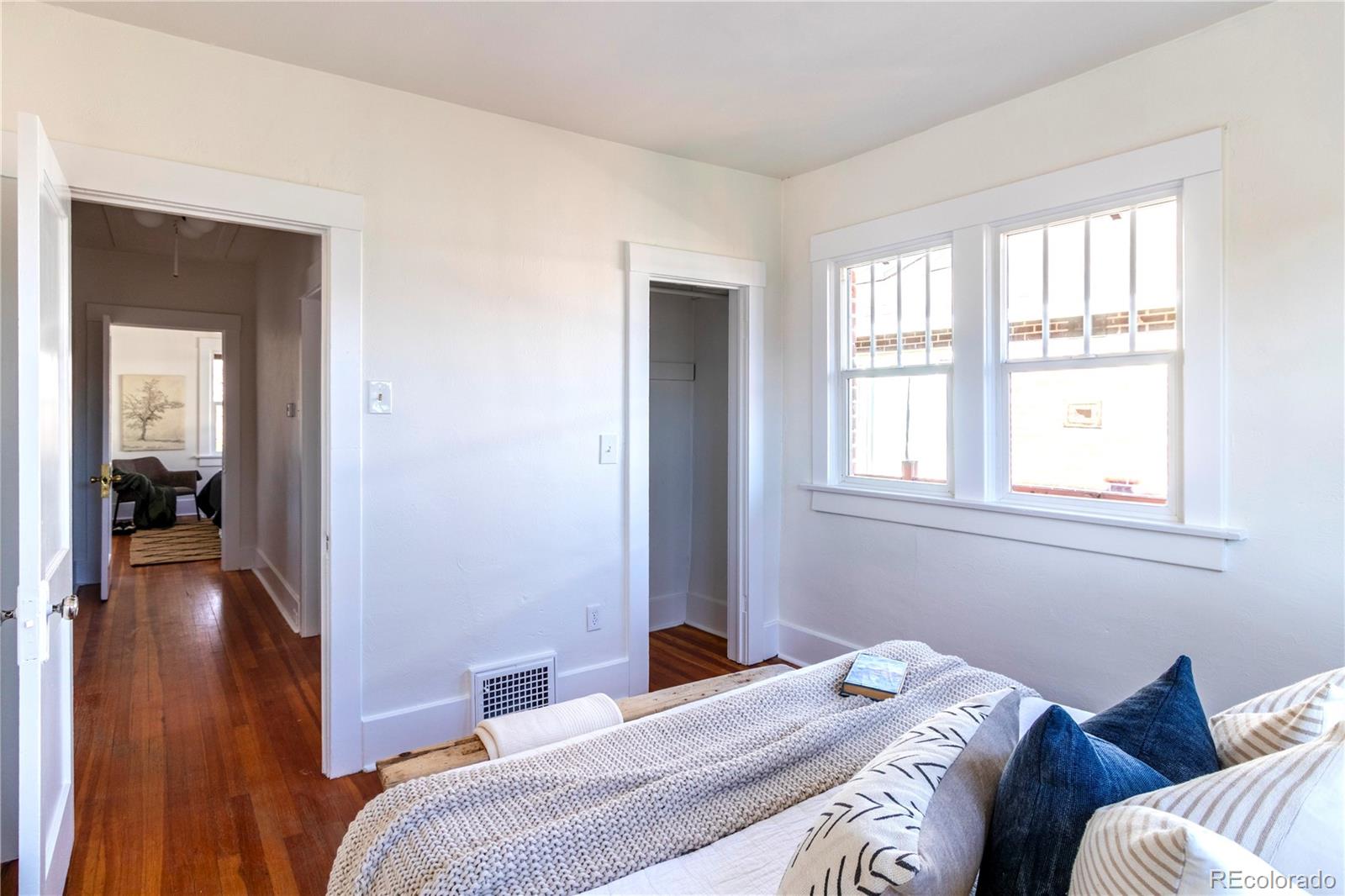 3200 Vine Street Denver, CO 80205 - Photo 10 of 31 a bedroom with a bed and a window
