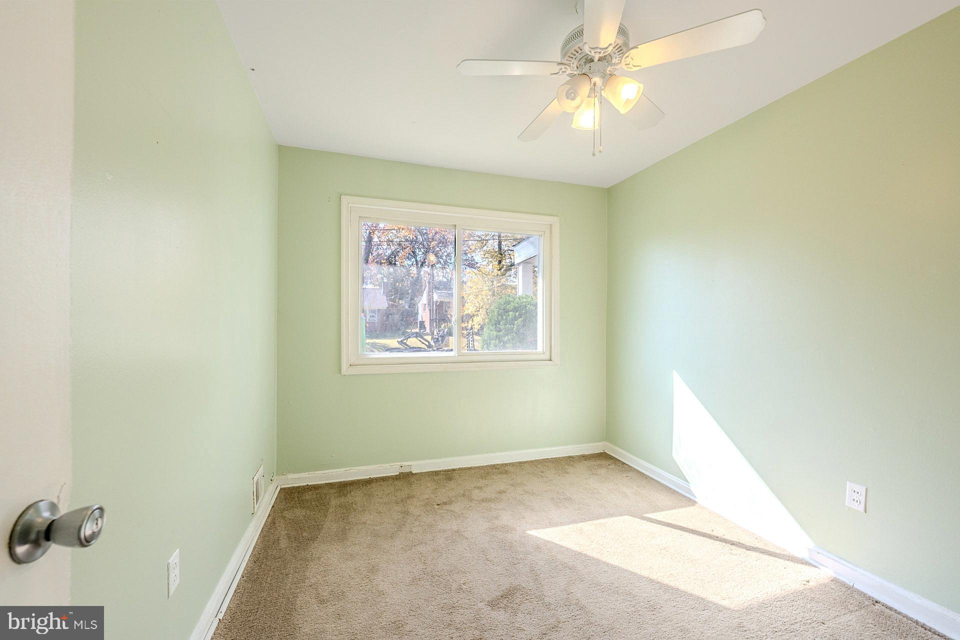 1108 Chickasaw Drive Silver Spring, MD 20903 - Photo 16 of 30 an empty room with a window and a fan
