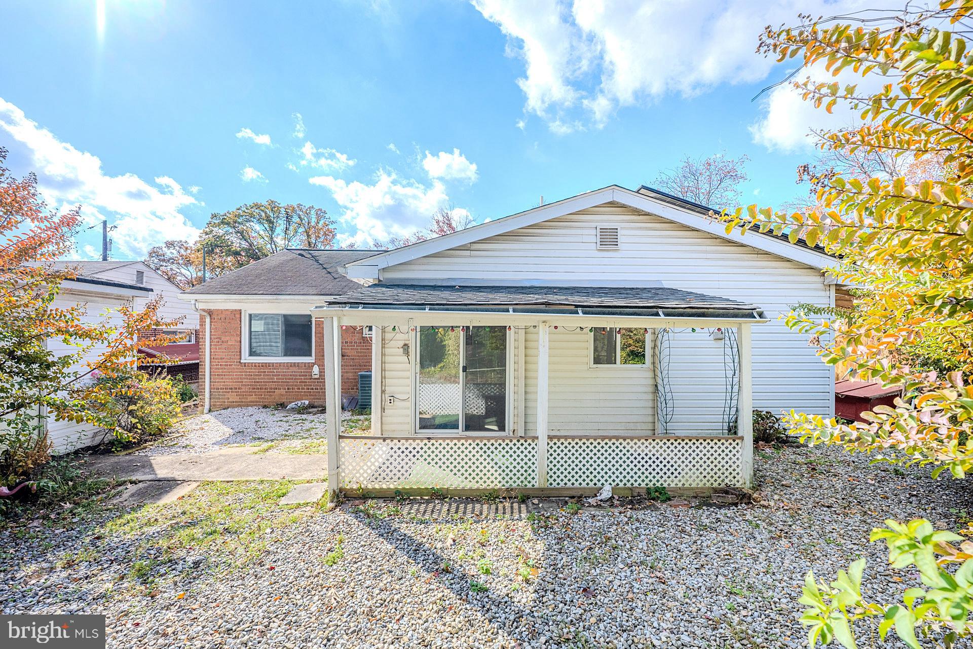 1108 Chickasaw Drive Silver Spring, MD 20903 - Photo 30 of 30 a front view of a house with a yard and garage