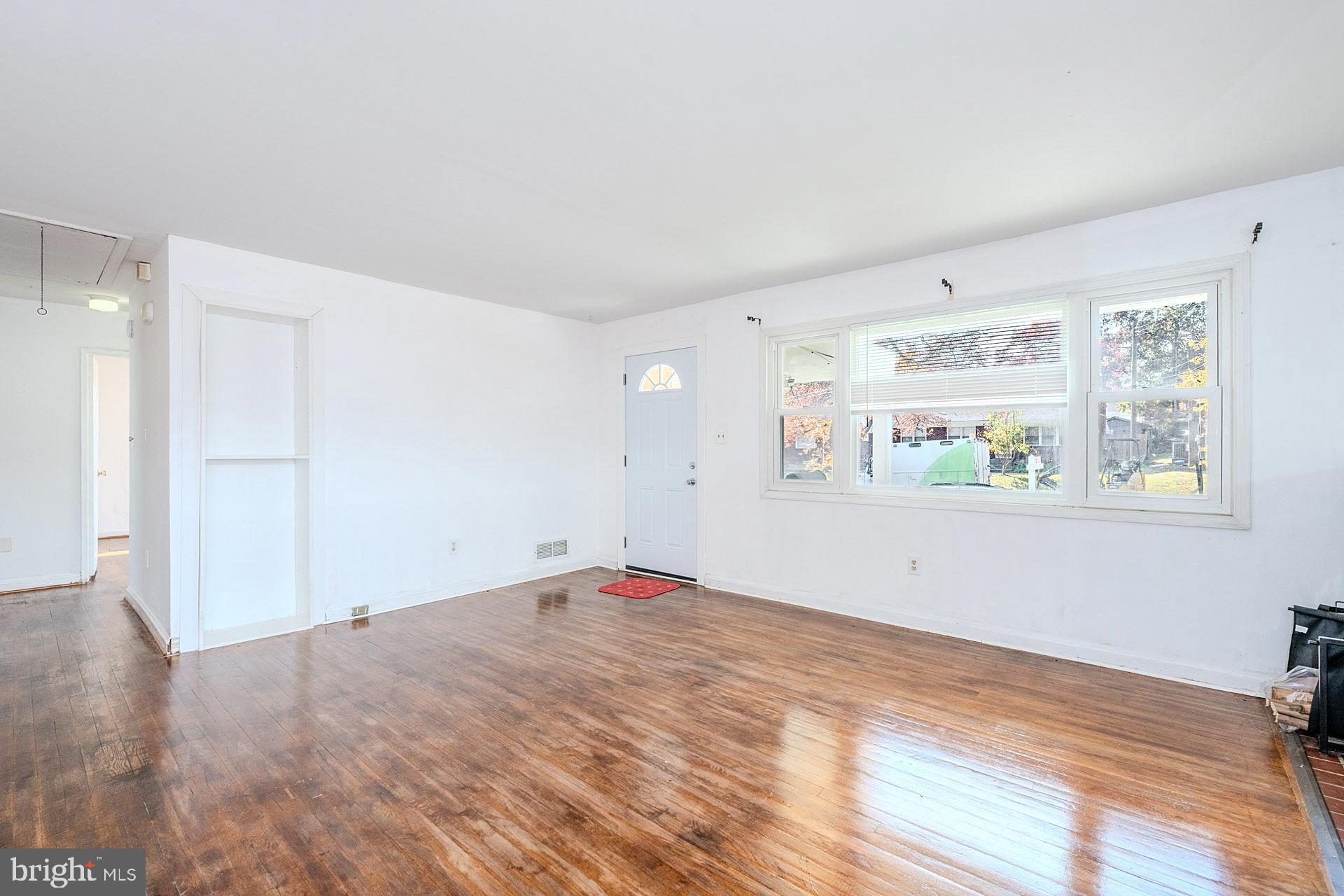 1108 Chickasaw Drive Silver Spring, MD 20903 - Photo 7 of 30 a view of empty room with window and wooden floor
