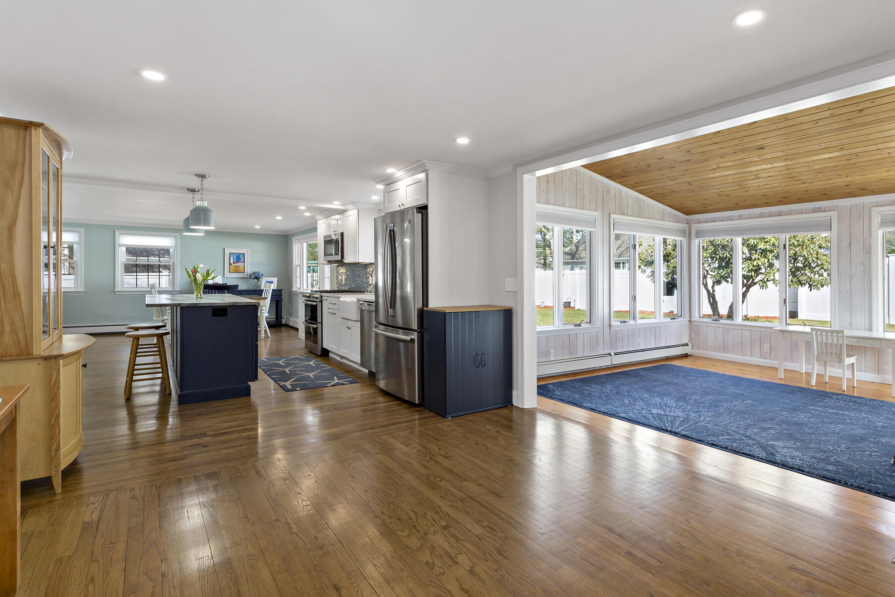 50 Deerfield Road Osterville, MA 02655 - Photo 11 of 32 a living room with stainless steel appliances kitchen island granite countertop wooden floors and large cabinets