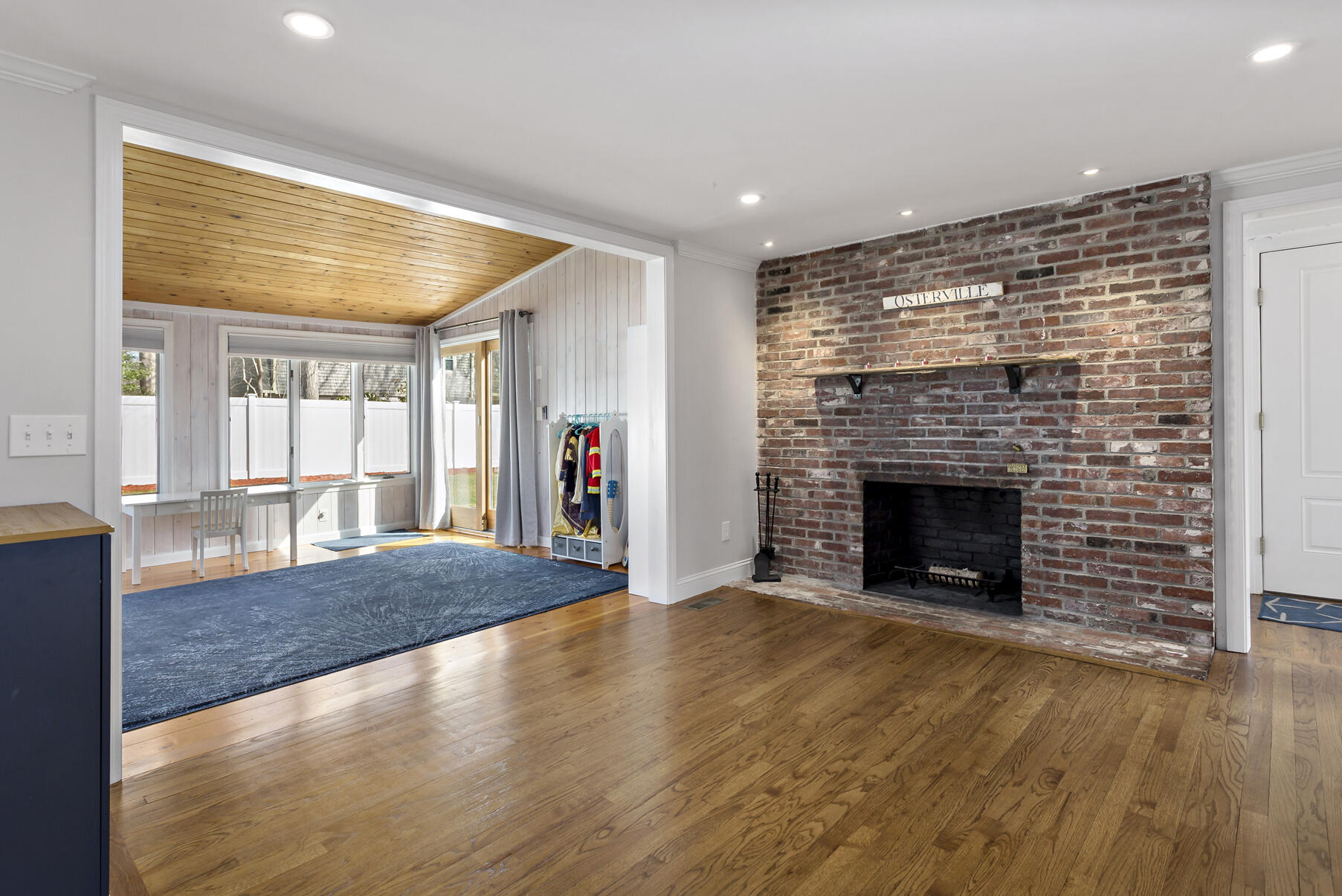 50 Deerfield Road Osterville, MA 02655 - Photo 12 of 32 a view of empty room with wooden floor and fireplace