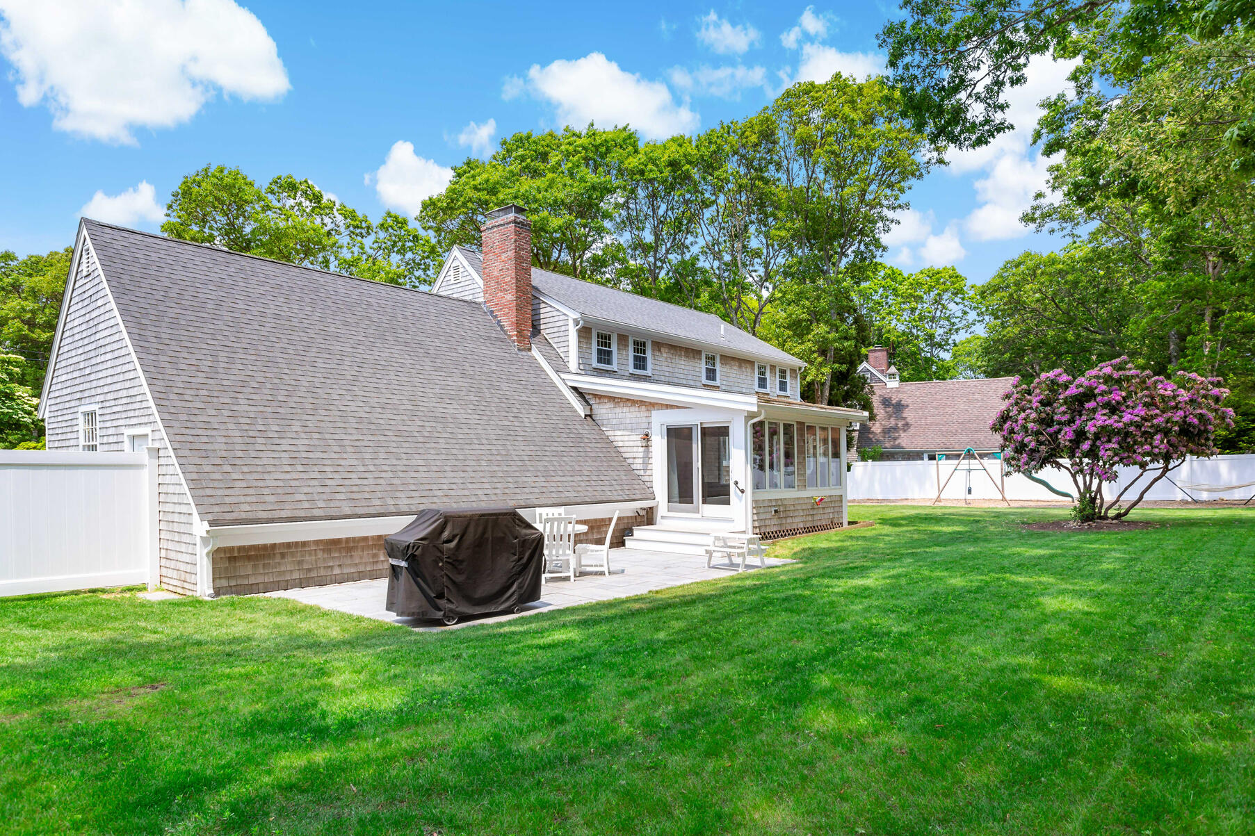 50 Deerfield Road Osterville, MA 02655 - Photo 27 of 32 a aerial view of a house with a yard and a garden