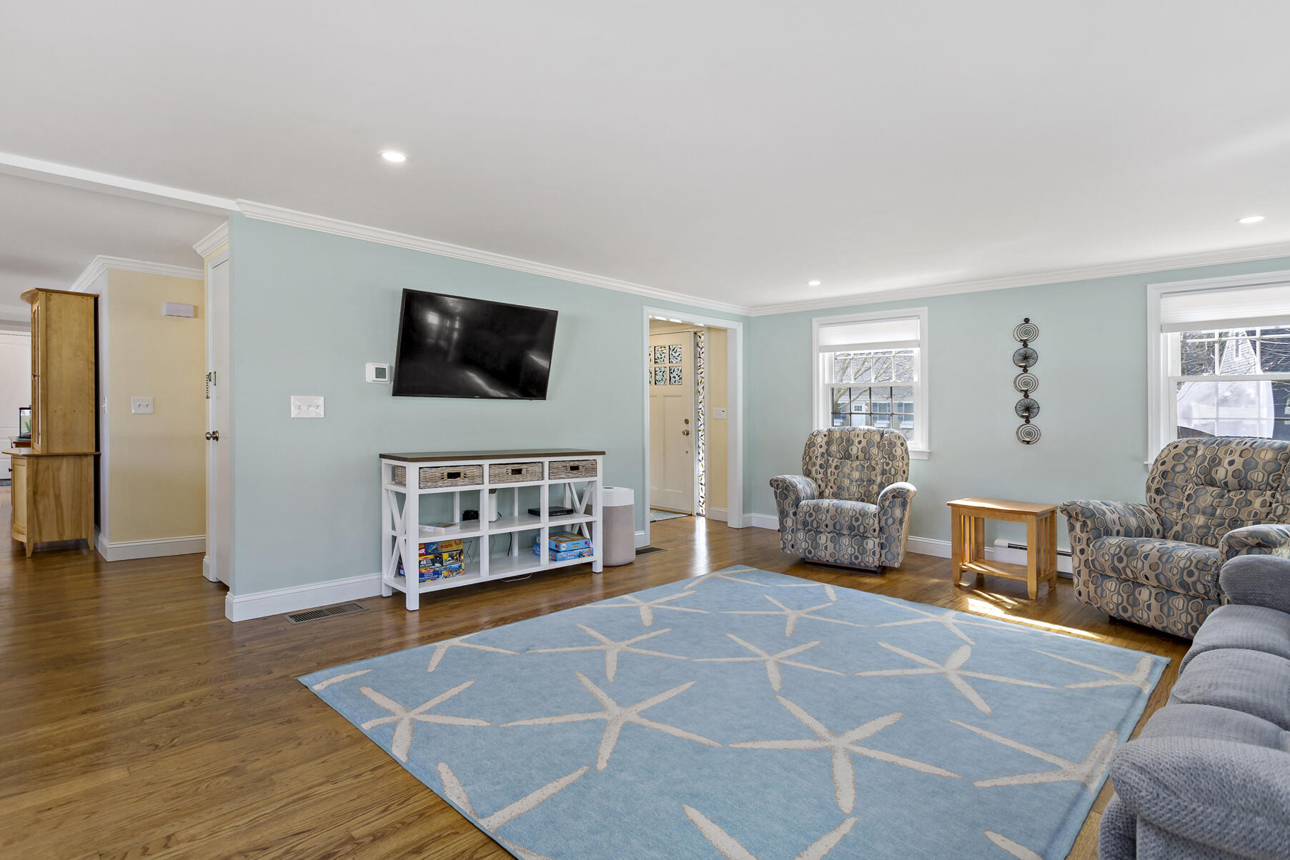 50 Deerfield Road Osterville, MA 02655 - Photo 4 of 32 a living room with furniture and a flat screen tv
