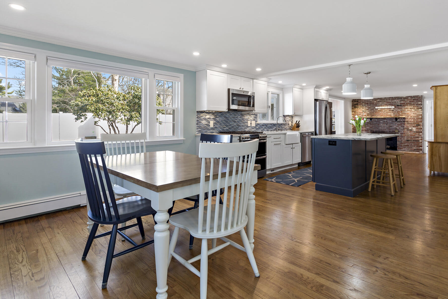 50 Deerfield Road Osterville, MA 02655 - Photo 6 of 32 a view of a dining room with furniture and wooden floor