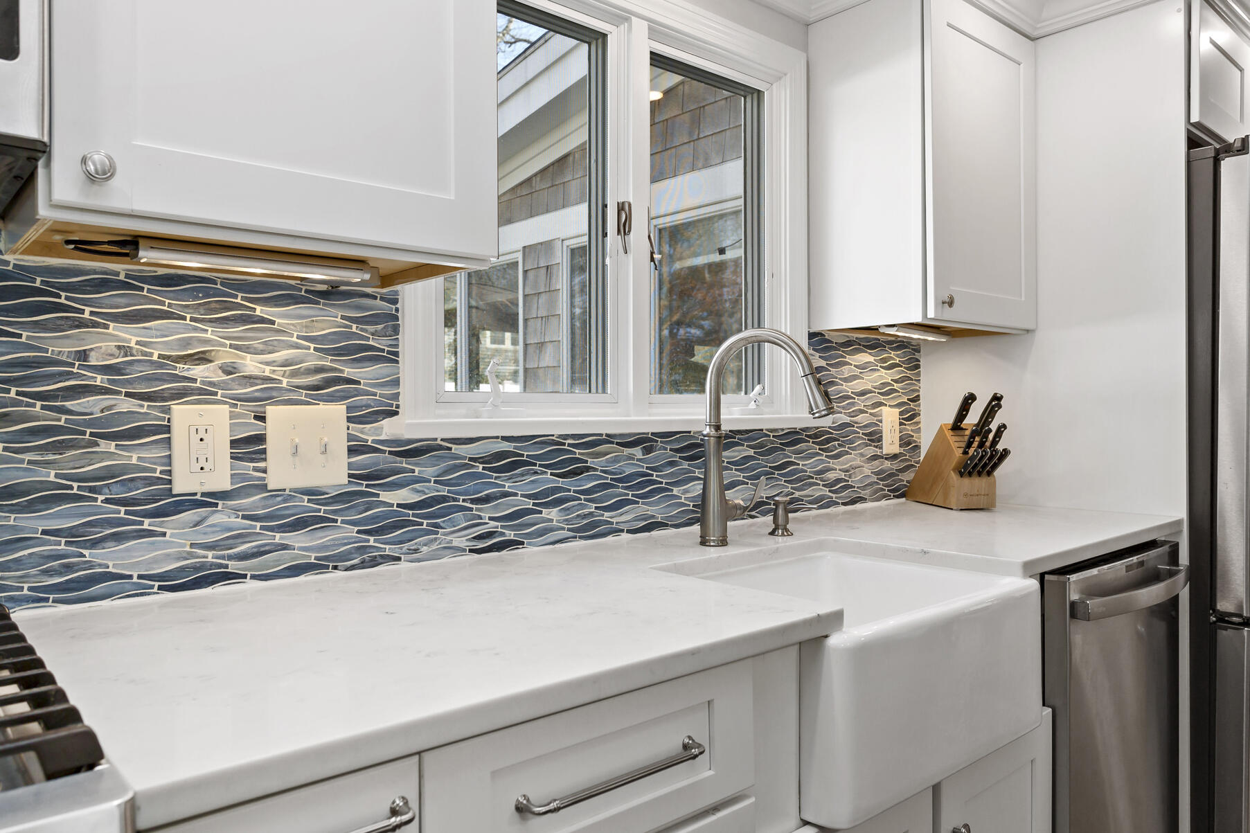 50 Deerfield Road Osterville, MA 02655 - Photo 9 of 32 a kitchen with a sink and a window