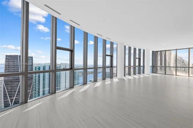 an aerial view of a house with a swimming pool