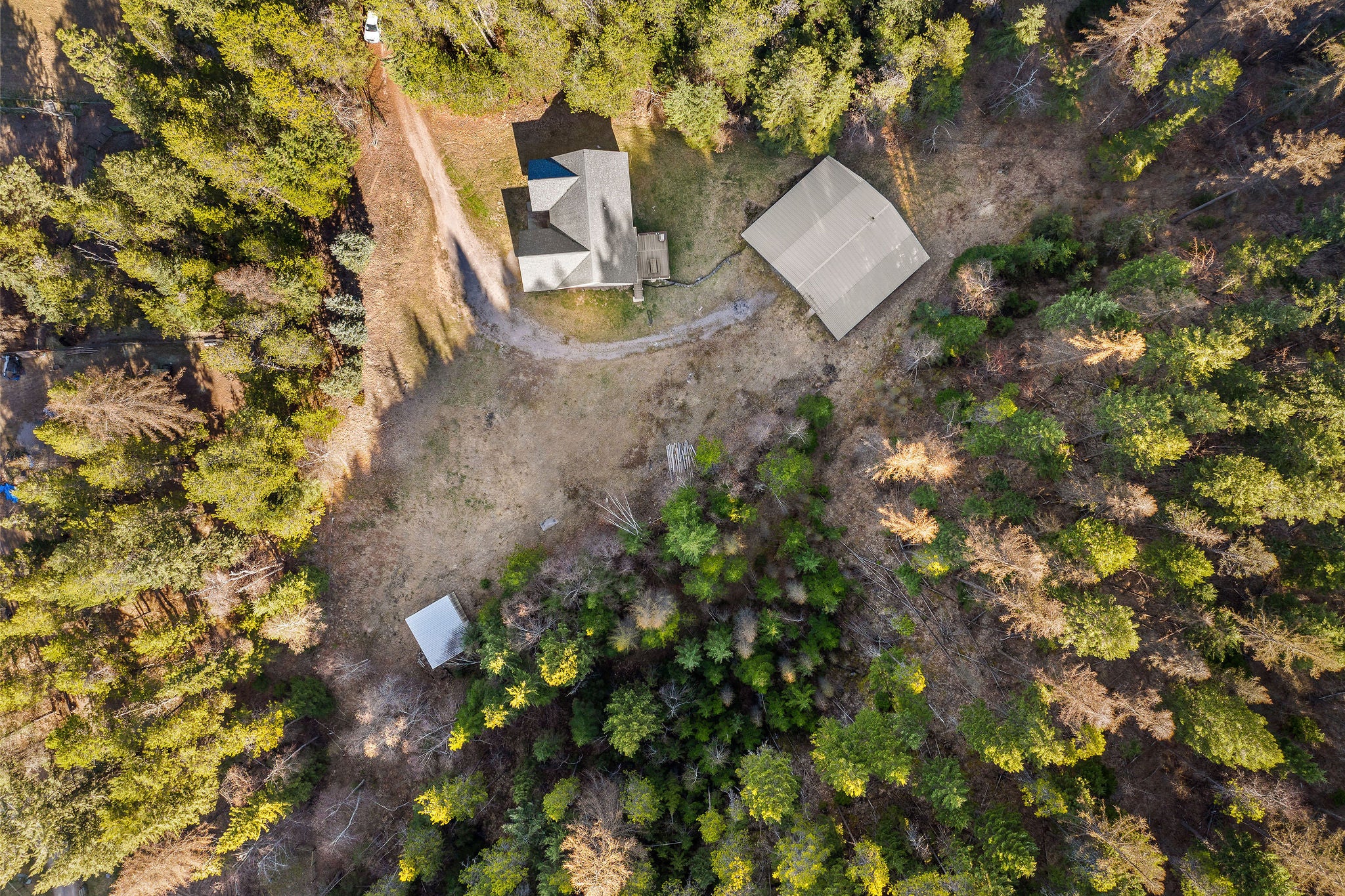 620 Swan River Road Bigfork, MT 59911 - Photo 42 of 50 Aerial of house and shop