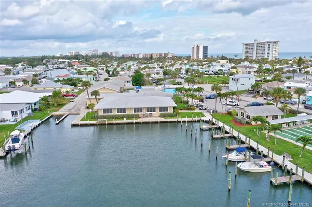a view of a house with backyard sitting area and garden